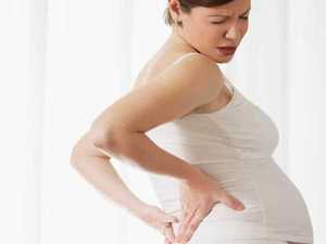 Почему болит спина во время беременности