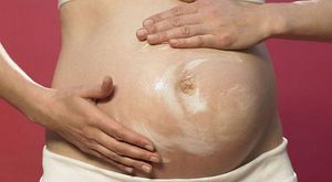 Почему болит пупок при беременности